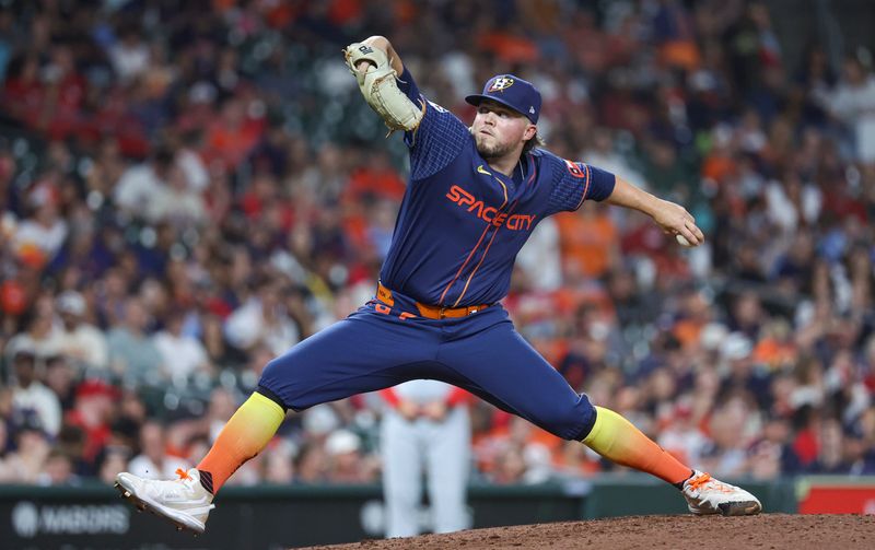 Jun 3, 2024; Houston, Texas, USA; Houston Astros relief pitcher Parker Mushinski (67) delivers a pitch during the sixth inning against the St. Louis Cardinals at Minute Maid Park. Mandatory Credit: Troy Taormina-USA TODAY Sports