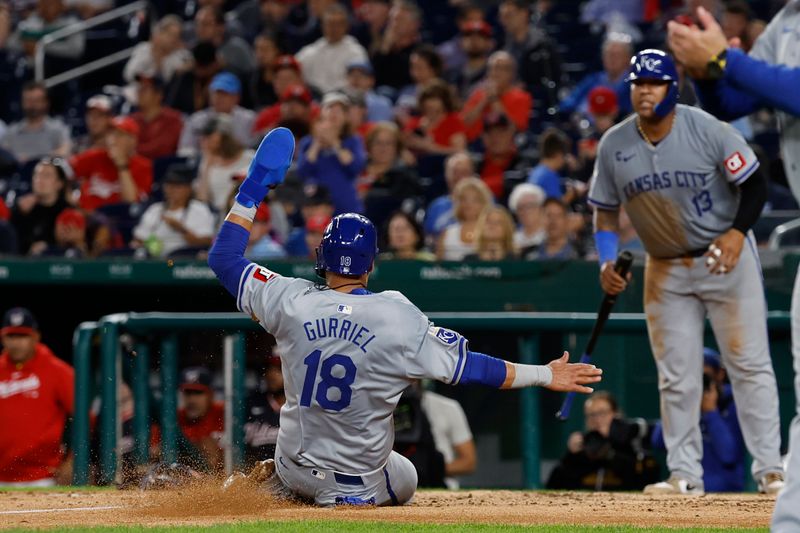 Sep 25, 2024; Washington, District of Columbia, USA; Kansas City Royals first baseman Yuli Gurriel (18) scores a run as Royals catcher Salvador Perez (13) looks on against the Washington Nationals during the sixth inning at Nationals Park. Mandatory Credit: Geoff Burke-Imagn Images