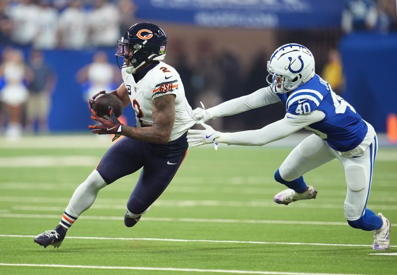 Chicago Bears wide receiver DJ Moore (2) runs past Indianapolis Colts cornerback Jaylon Jones (40) during the first half of an NFL football game Sunday, Sept. 22, 2024, in Indianapolis. (AP Photo/Michael Conroy)