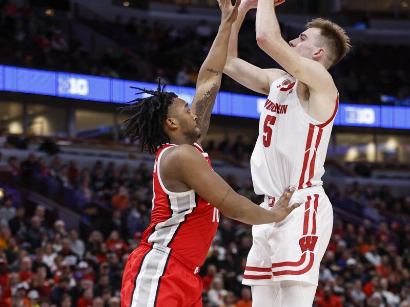 Mar 8, 2023; Chicago, IL, USA; Wisconsin Badgers forward Tyler Wahl (5) shoots against Ohio State Buckeyes forward Brice Sensabaugh (10) during the second half at United Center. Mandatory Credit: Kamil Krzaczynski-USA TODAY Sports