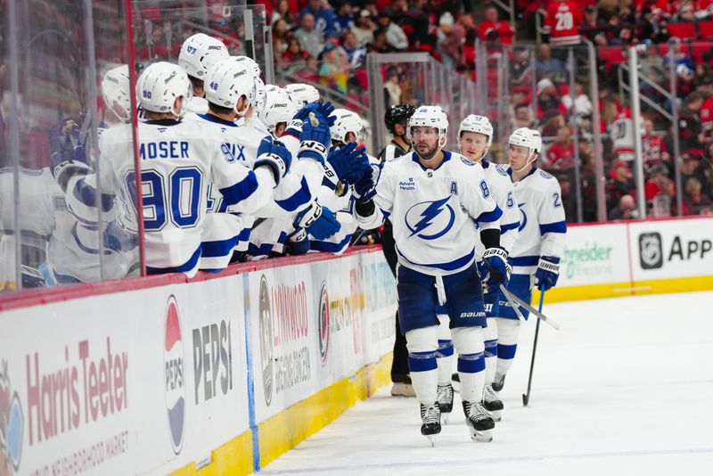 Oct 11, 2024; Raleigh, North Carolina, USA;  Tampa Bay Lightning right wing Nikita Kucherov (86) celebrates his goal against the Carolina Hurricanes during the third period at PNC Arena. Mandatory Credit: James Guillory-Imagn Images