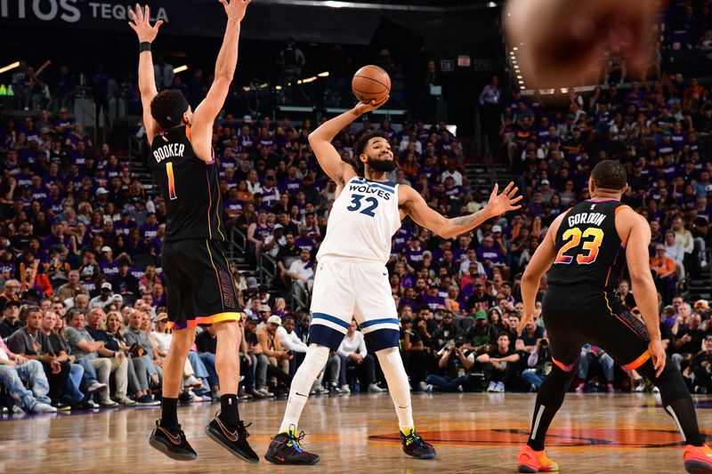 PHOENIX, AZ - APRIL  28: Karl-Anthony Towns #32 of the Minnesota Timberwolves looks to pass the ball during the game against the Phoenix Suns during Round 1 Game 4 of the 2024 NBA Playoffs on April 28, 2024 at Footprint Center in Phoenix, Arizona. NOTE TO USER: User expressly acknowledges and agrees that, by downloading and or using this photograph, user is consenting to the terms and conditions of the Getty Images License Agreement. Mandatory Copyright Notice: Copyright 2024 NBAE (Photo by Kate Frese/NBAE via Getty Images)