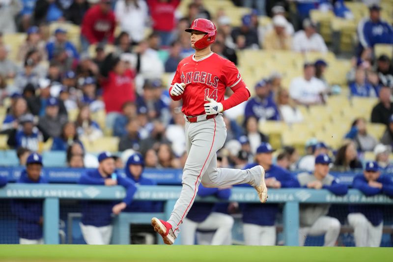 Mar 25, 2024; Los Angeles, California, USA; Los Angeles Angels catcher Logan O'Hoppe (14) runs the bases after hitting a three-run home run in the second inning against the Los Angeles Dodgers at Dodger Stadium. Mandatory Credit: Kirby Lee-USA TODAY Sports