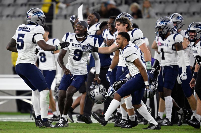 Oct 21, 2023; San Diego, California, USA; Nevada Wolf Pack wide receiver Dalevon Campbell (5) celebrates with teammates after defeating the San Diego State Aztecs at Snapdragon Stadium. Mandatory Credit: Orlando Ramirez-USA TODAY Sports 