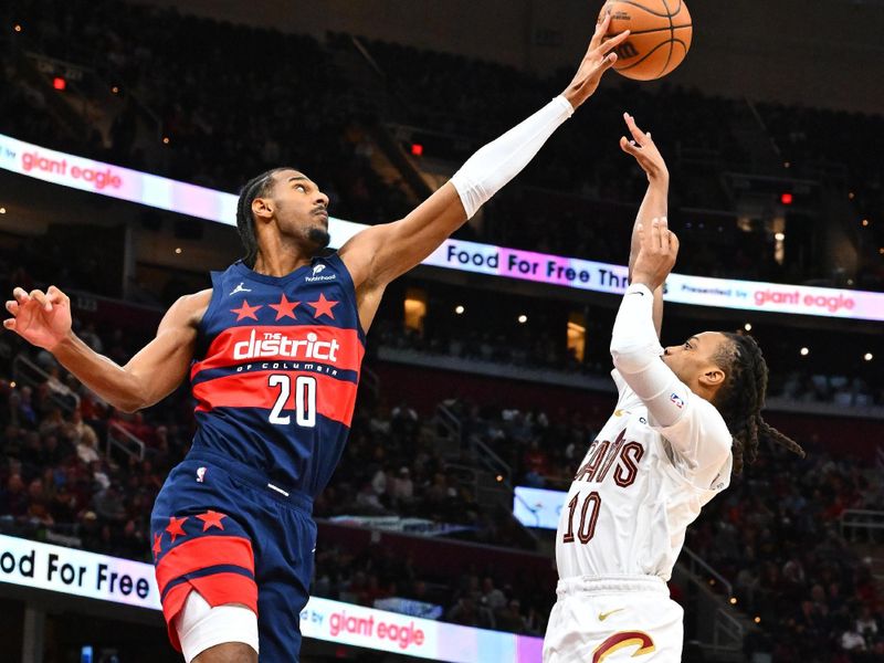 CLEVELAND, OHIO - DECEMBER 13: Darius Garland #10 of the Cleveland Cavaliers is blocked by Alexandre Sarr #20 of the Washington Wizards during the fourth quarter at Rocket Mortgage Fieldhouse on December 13, 2024 in Cleveland, Ohio. The Cavaliers defeated the Wizards 115-105. NOTE TO USER: User expressly acknowledges and agrees that, by downloading and or using this photograph, User is consenting to the terms and conditions of the Getty Images License Agreement. (Photo by Jason Miller/Getty Images)