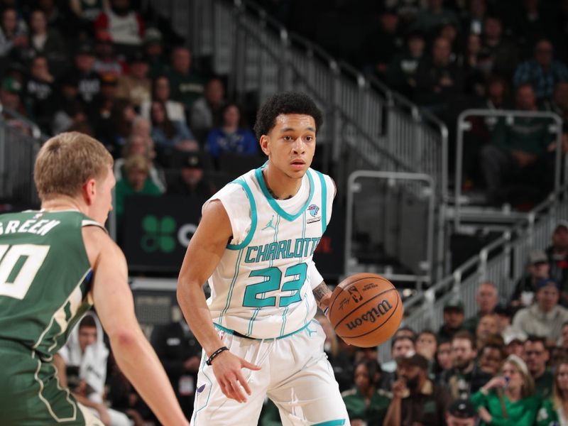 MILWAUKEE, WI - FEBRUARY 27: Tre Mann #23 of the Charlotte Hornets  handles the ball during the game against the Milwaukee Bucks on February 27, 2024 at the Fiserv Forum Center in Milwaukee, Wisconsin. NOTE TO USER: User expressly acknowledges and agrees that, by downloading and or using this Photograph, user is consenting to the terms and conditions of the Getty Images License Agreement. Mandatory Copyright Notice: Copyright 2024 NBAE (Photo by Gary Dineen/NBAE via Getty Images).