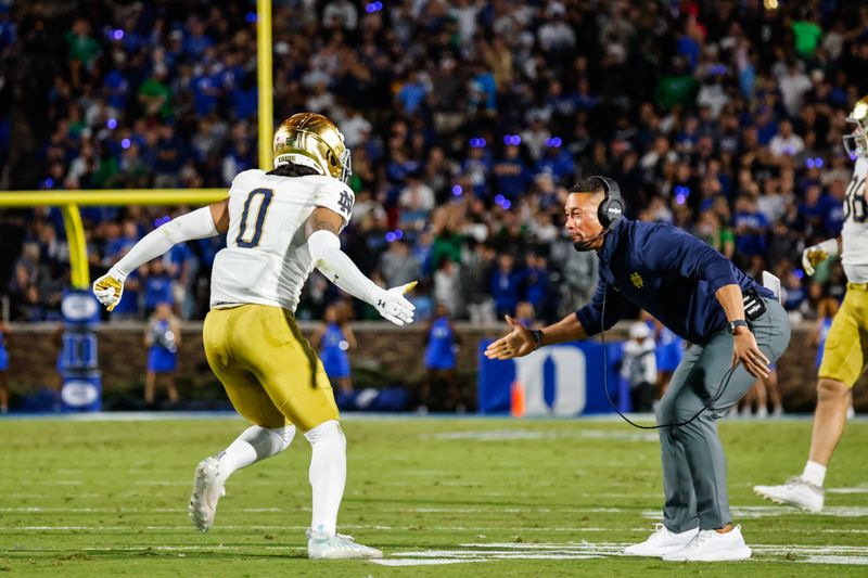 Sep 30, 2023; Durham, North Carolina, USA; Notre Dame Fighting Irish wide receiver Deion Colzie (0) celebrates with Notre Dame Fighting Irish head coach Marcus Freeman during the first half of the game against Duke Blue Devils at Wallace Wade Stadium. Mandatory Credit: Jaylynn Nash-USA TODAY Sports