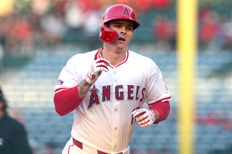 Jul 10, 2024; Anaheim, California, USA;  Los Angeles Angels center fielder Mickey Moniak (16) runs the bases after hitting a three-run home run in the second inning against the Texas Rangers at Angel Stadium. Mandatory Credit: Kirby Lee-USA TODAY Sports