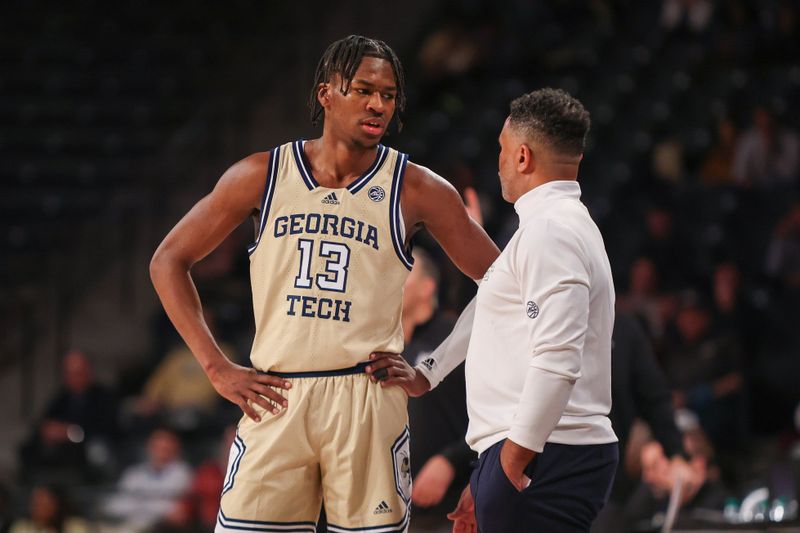 Nov 28, 2023; Atlanta, Georgia, USA; Georgia Tech Yellow Jackets guard Miles Kelly (13) talks to head coach Damon Stoudamire against the Mississippi State Bulldogs in the second half at McCamish Pavilion. Mandatory Credit: Brett Davis-USA TODAY Sports
