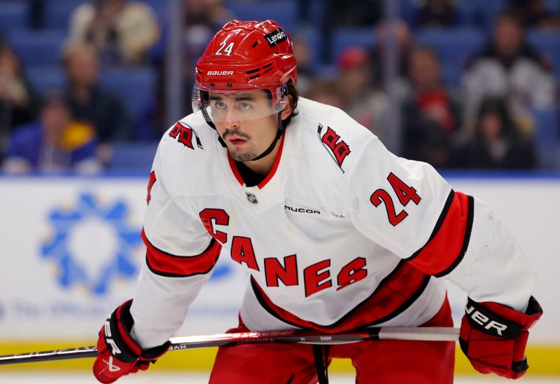 Jan 15, 2025; Buffalo, New York, USA;  Carolina Hurricanes center Seth Jarvis (24) waits for the face-off during the first period against the Buffalo Sabres at KeyBank Center. Mandatory Credit: Timothy T. Ludwig-Imagn Images