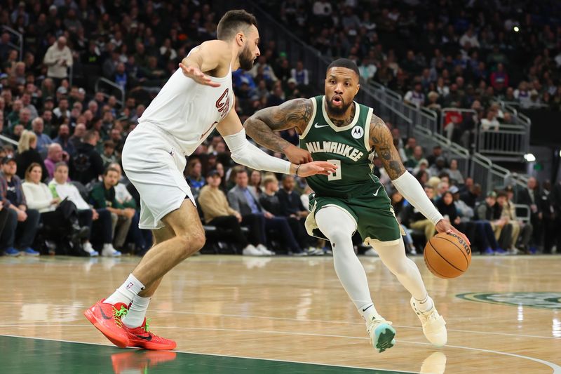 MILWAUKEE, WISCONSIN - JANUARY 24: Damian Lillard #0 of the Milwaukee Bucks is defended by Max Strus #1 of the Cleveland Cavaliers during a game at Fiserv Forum on January 24, 2024 in Milwaukee, Wisconsin. NOTE TO USER: User expressly acknowledges and agrees that, by downloading and or using this photograph, User is consenting to the terms and conditions of the Getty Images License Agreement. (Photo by Stacy Revere/Getty Images)