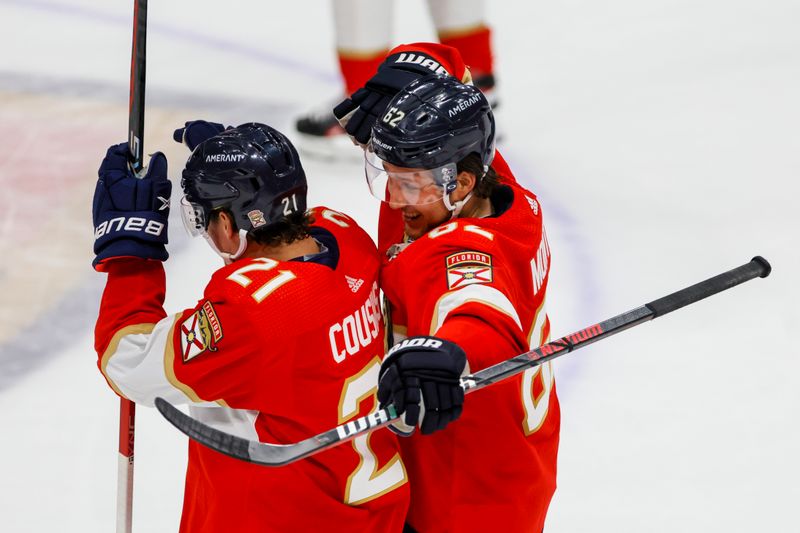 Apr 4, 2023; Sunrise, Florida, USA; Florida Panthers defenseman Brandon Montour (62) celebrates with center Nick Cousins (21) after winning the game against the Buffalo Sabres at FLA Live Arena. Mandatory Credit: Sam Navarro-USA TODAY Sports