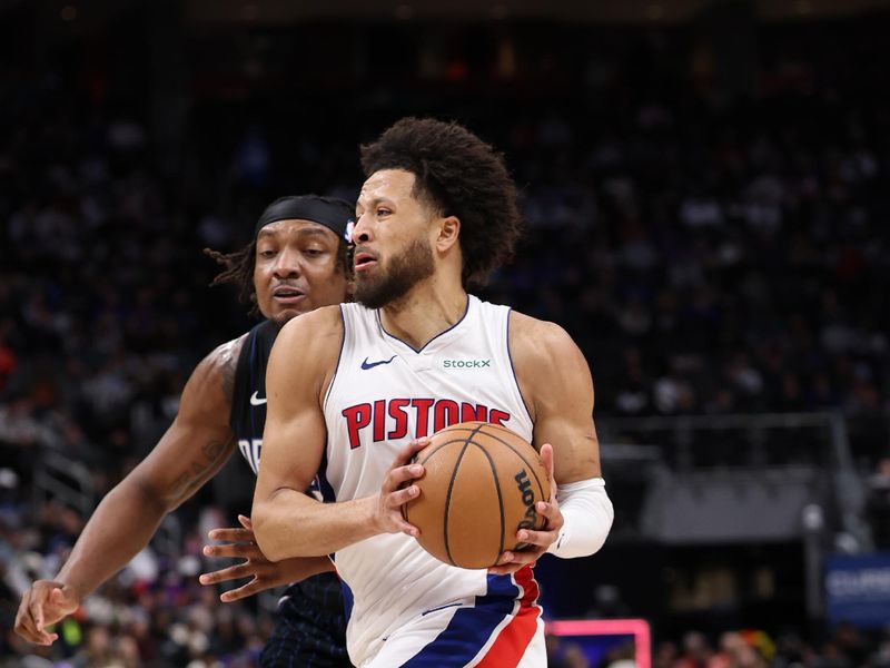 DETROIT, MICHIGAN - JANUARY 01: Cade Cunningham #2 of the Detroit Pistons drives around Wendell Carter Jr. #34 of the Orlando Magic during the second half at Little Caesars Arena on January 01, 2025 in Detroit, Michigan. Detroit won the game 105-96. NOTE TO USER: User expressly acknowledges and agrees that, by downloading and or using this photograph, User is consenting to the terms and conditions of the Getty Images License. (Photo by Gregory Shamus/Getty Images)