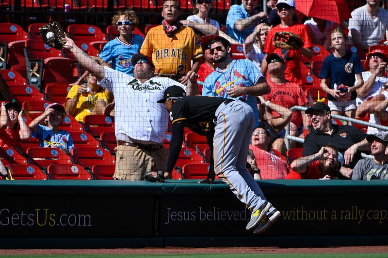 Sep 3, 2023; St. Louis, Missouri, USA;  Pittsburgh Pirates third baseman Ke'Bryan Hayes (13) looks on as a St. Louis Cardinals fan misses a foul ball during the sixth inning at Busch Stadium. Mandatory Credit: Jeff Curry-USA TODAY Sports