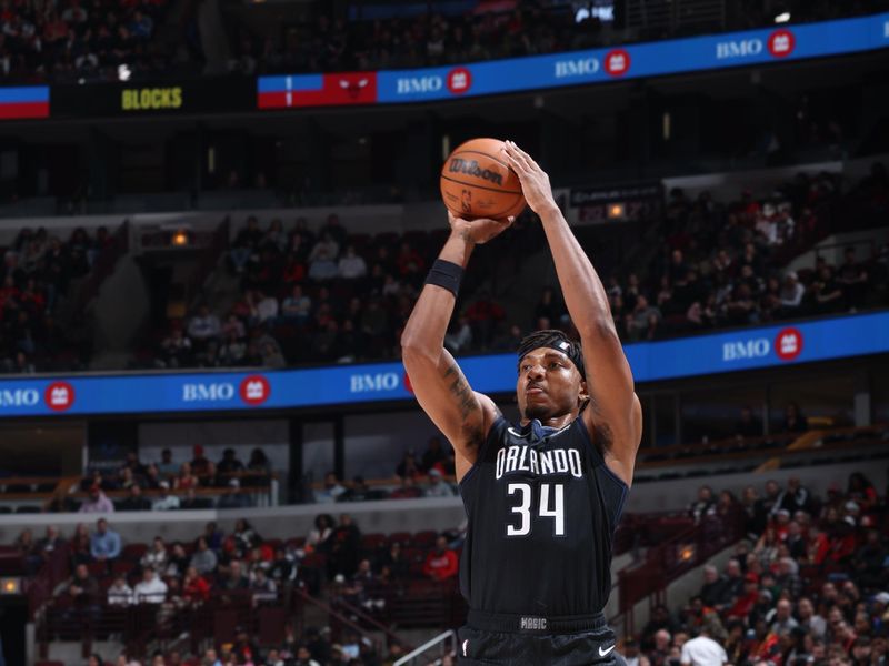 CHICAGO, IL - FERUARY 13: Wendell Carter Jr. #34 of the Orlando Magic shoots a three point basket during the game against the Chicago Bulls on February 13, 2023 at United Center in Chicago, Illinois. NOTE TO USER: User expressly acknowledges and agrees that, by downloading and or using this photograph, User is consenting to the terms and conditions of the Getty Images License Agreement. Mandatory Copyright Notice: Copyright 2023 NBAE (Photo by Jeff Haynes/NBAE via Getty Images)