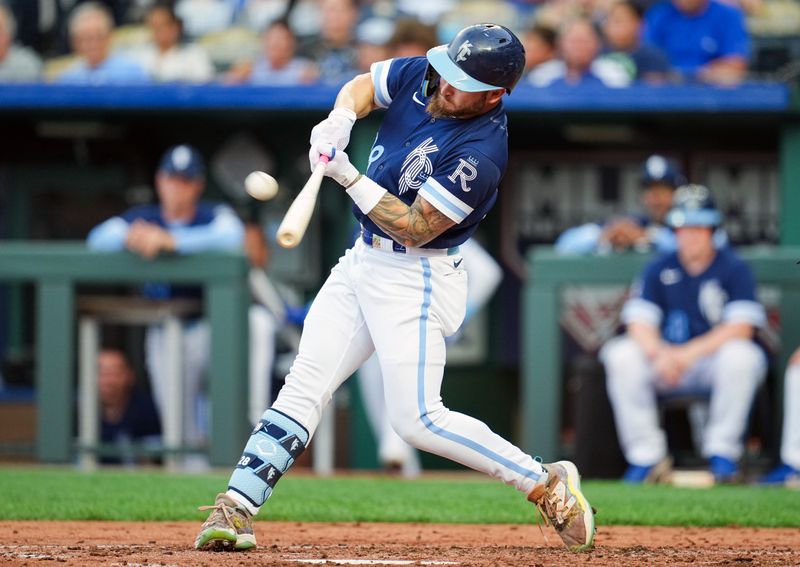 Jul 28, 2023; Kansas City, Missouri, USA; Kansas City Royals center fielder Kyle Isbel (28) hits a home run during the third inning against the Minnesota Twins at Kauffman Stadium. Mandatory Credit: Jay Biggerstaff-USA TODAY Sports