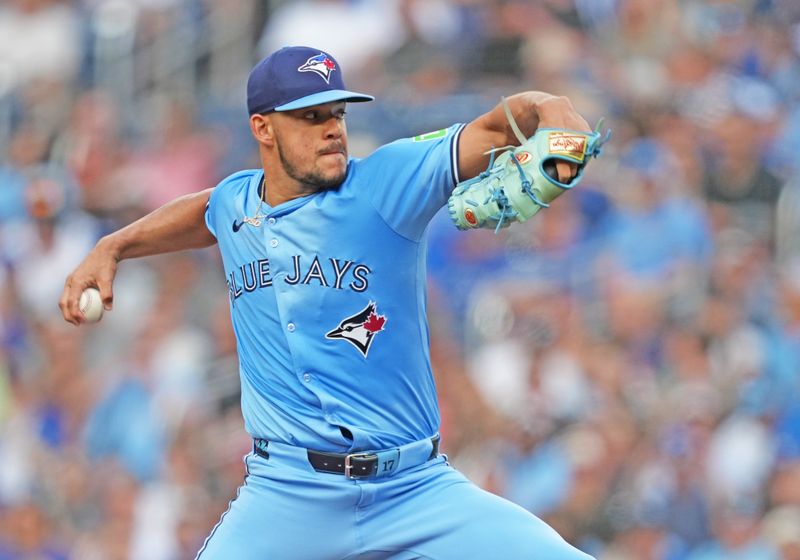 Jul 23, 2024; Toronto, Ontario, CAN; Toronto Blue Jays starting pitcher Jose Berríos (17) throws a pitch against the Tampa Bay Rays during the first inning at Rogers Centre. Mandatory Credit: Nick Turchiaro-USA TODAY Sports