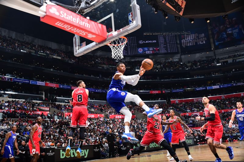 LOS ANGELES, CA - MARCH 27: Russell Westbrook  #0 of the LA Clippers passes the ball during the game during the game against the Chicago Bulls on March 27, 2023 at Crypto.Com Arena in Los Angeles, California. NOTE TO USER: User expressly acknowledges and agrees that, by downloading and/or using this Photograph, user is consenting to the terms and conditions of the Getty Images License Agreement. Mandatory Copyright Notice: Copyright 2023 NBAE (Photo by Adam Pantozzi/NBAE via Getty Images)