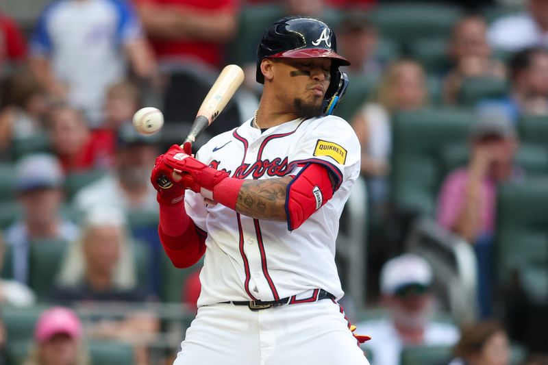 Sep 30, 2024; Atlanta, Georgia, USA; Atlanta Braves shortstop Orlando Arcia (11) gets out of the way of a pitch against the New York Mets in the fourth inning at Truist Park. Mandatory Credit: Brett Davis-Imagn Images
