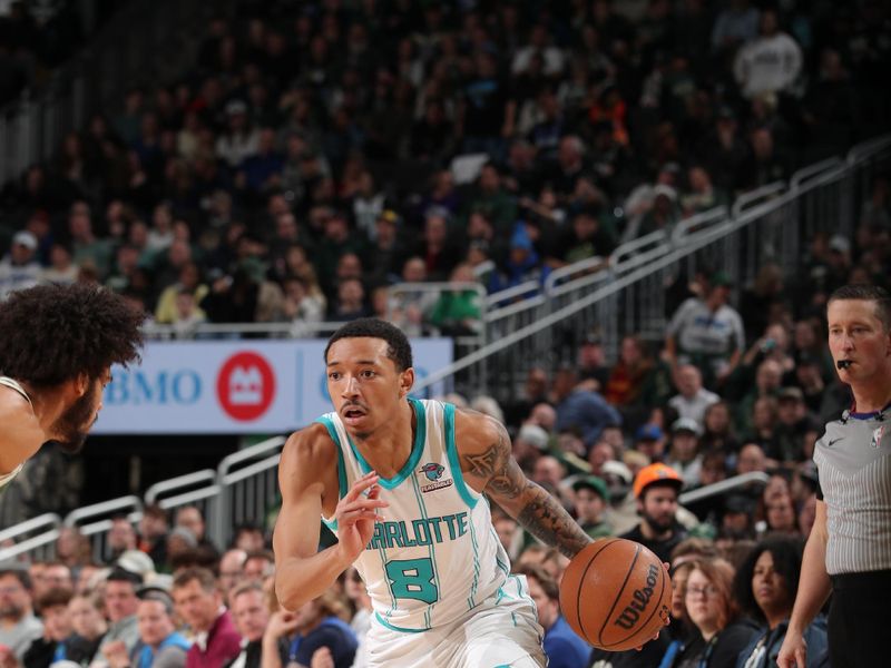 MILWAUKEE, WI - FEBRUARY 9: Nick Smith Jr. #8 of the Charlotte Hornets handles the ball during the game against the Milwaukee Bucks on February 9, 2024 at the Fiserv Forum Center in Milwaukee, Wisconsin. NOTE TO USER: User expressly acknowledges and agrees that, by downloading and or using this Photograph, user is consenting to the terms and conditions of the Getty Images License Agreement. Mandatory Copyright Notice: Copyright 2024 NBAE (Photo by Gary Dineen/NBAE via Getty Images).