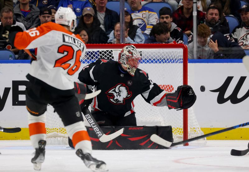 Nov 3, 2023; Buffalo, New York, USA;  Buffalo Sabres goaltender Ukko-Pekka Luukkonen (1) looks to make a save on Philadelphia Flyers defenseman Sean Walker (26) during the second period at KeyBank Center. Mandatory Credit: Timothy T. Ludwig-USA TODAY Sports