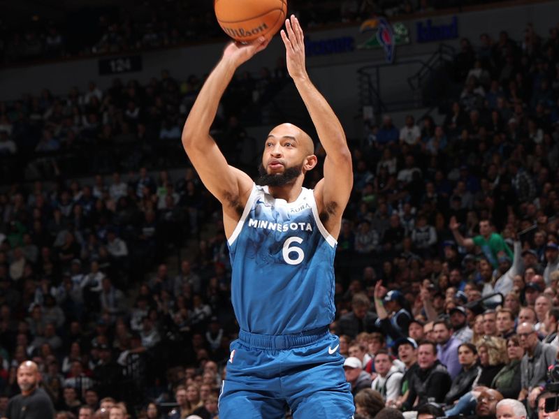 MINNEAPOLIS, MN -  MARCH 22: Jordan McLaughlin #6 of the Minnesota Timberwolves three point basket during the game against the Cleveland Cavaliers on March 22, 2024 at Target Center in Minneapolis, Minnesota. NOTE TO USER: User expressly acknowledges and agrees that, by downloading and or using this Photograph, user is consenting to the terms and conditions of the Getty Images License Agreement. Mandatory Copyright Notice: Copyright 2024 NBAE (Photo by David Sherman/NBAE via Getty Images)