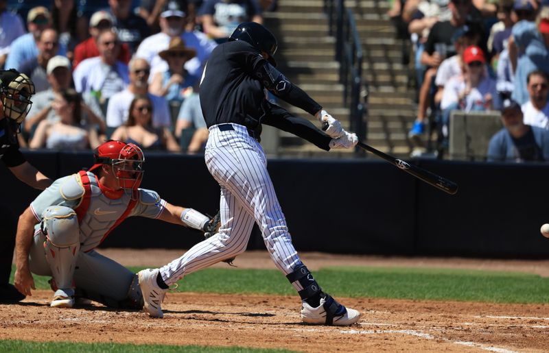 Mar 22, 2026; Tampa, Florida, USA;New York Yankees infielder Ryan McMahon (19) hits an RBI single during the fourth inning against the Philadelphia Phillies at George M. Steinbrenner Field. Mandatory Credit: Kim Klement Neitzel-Imagn Images