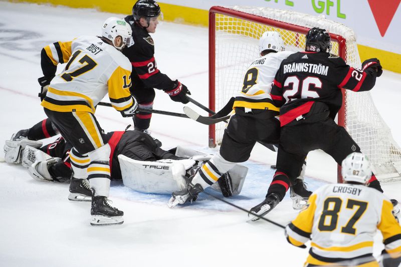 Mar 12, 2024; Ottawa, Ontario, CAN; Pittsburgh Penguins left wing Micheal Bunting (8) scores against Ottawa Senators goalie Joonas Korpisalo (70) in the third period at the Canadian Tire Centre. Mandatory Credit: Marc DesRosiers-USA TODAY Sports