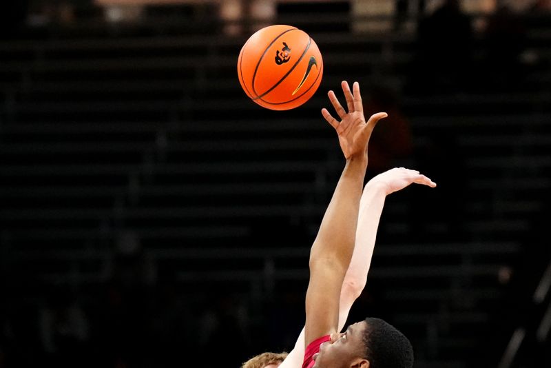 Feb 23, 2023; Boulder, Colorado, USA; Colorado Buffaloes center Lawson Lovering (34) and USC Trojans forward Joshua Morgan (24) reach for the tip off in the first half at the CU Events Center. Mandatory Credit: Ron Chenoy-USA TODAY Sports