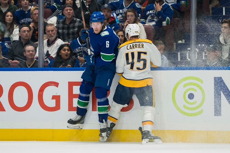 Apr 30, 2024; Vancouver, British Columbia, CAN; Nashville Predators defenseman Alexandre Carrier (45) checks Vancouver Canucks forward Brock Boeser (6) during the first period in game five of the first round of the 2024 Stanley Cup Playoffs at Rogers Arena. Mandatory Credit: Bob Frid-USA TODAY Sports