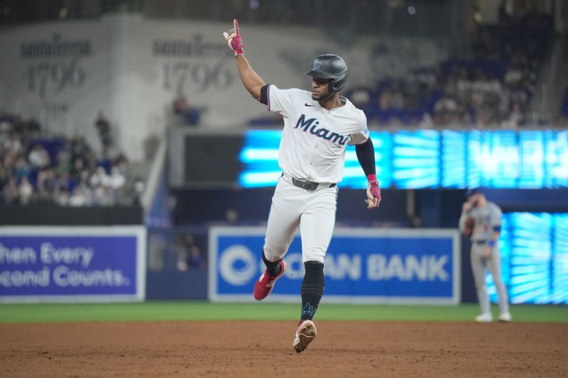 Sep 17, 2024; Miami, Florida, USA;  Miami Marlins second baseman Otto Lopez (61) rounds the bases after hitting a solo home run in the third inning against the Los Angeles Dodgers at loanDepot Park. Mandatory Credit: Jim Rassol-Imagn Images