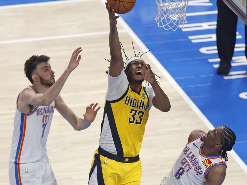 OKLAHOMA CITY, OK - JUNE 5: Myles Turner #33 of the Indiana Pacers drives to the basket during the game against the Oklahoma City Thunder during Game One of the 2025 NBA Finals on June 5, 2025 at Paycom Center in Oklahoma City, Oklahoma. NOTE TO USER: User expressly acknowledges and agrees that, by downloading and or using this photograph, User is consenting to the terms and conditions of the Getty Images License Agreement. Mandatory Copyright Notice: Copyright 2025 NBAE (Photo by Logan Riely/NBAE via Getty Images)