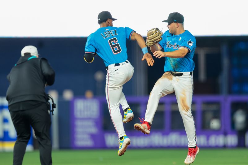 Sep 7, 2025; Miami, Florida, USA; Miami Marlins shortstop Otto Lopez (6) and center fielder Jakob Marsee (87) celebrate after the game against the Philadelphia Phillies at loanDepot Park. Mandatory Credit: Sam Navarro-Imagn Images