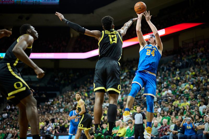 Feb 11, 2023; Eugene, Oregon, USA;  UCLA Bruins guard Jaime Jaquez Jr. (24) shoots a jump shot during the second half against Oregon Ducks forward Quincy Guerrier (13) at Matthew Knight Arena. Mandatory Credit: Troy Wayrynen-USA TODAY Sports