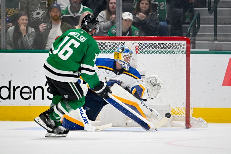 Apr 17, 2024; Dallas, Texas, USA; St. Louis Blues goaltender Jordan Binnington (50) stops a shot by Dallas Stars center Joe Pavelski (16) during the overtime shootout at the American Airlines Center. Mandatory Credit: Jerome Miron-USA TODAY Sports