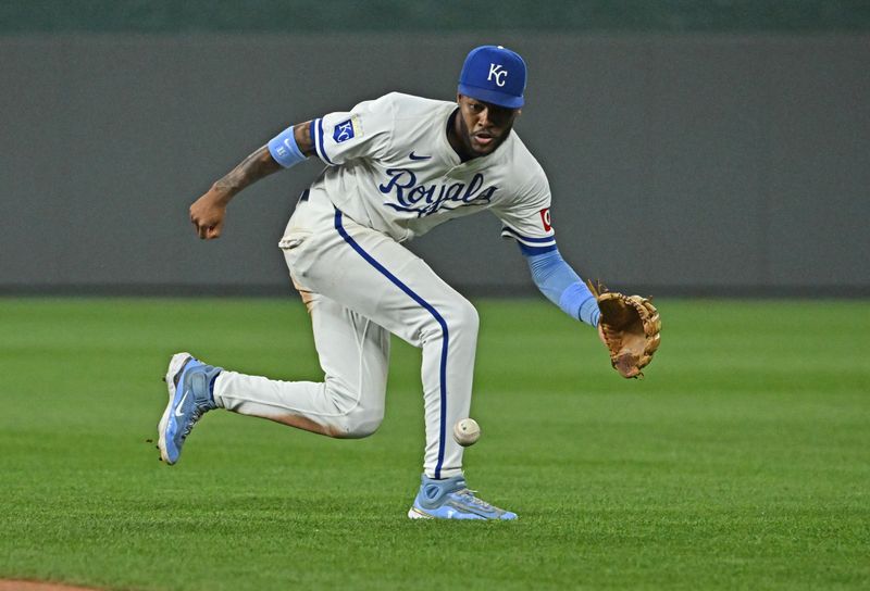 Jun 27, 2024; Kansas City, Missouri, USA;  Kansas City Royals second baseman Maikel Garcia (11) fields a ground  ball in the ninth inning against the Cleveland Guardians at Kauffman Stadium. Mandatory Credit: Peter Aiken-USA TODAY Sports