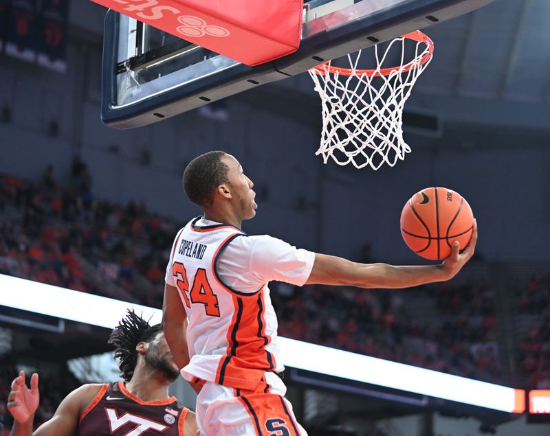 Feb 27, 2024; Syracuse, New York, USA; Syracuse Orange guard Quadir Copeland (24) attempts a reverse lay up in the second half against the Virginia Tech Hokies at the JMA Wireless Dome. Mandatory Credit: Mark Konezny-USA TODAY Sports