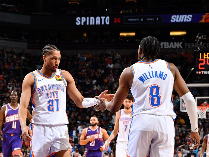 PHOENIX, AZ - MARCH 3: Aaron Wiggins #21 and Jalen Williams #8 of the Oklahoma City Thunder high five during the game against the Phoenix Suns on March 3, 2024 at Footprint Center in Phoenix, Arizona. NOTE TO USER: User expressly acknowledges and agrees that, by downloading and or using this photograph, user is consenting to the terms and conditions of the Getty Images License Agreement. Mandatory Copyright Notice: Copyright 2024 NBAE (Photo by Barry Gossage/NBAE via Getty Images)