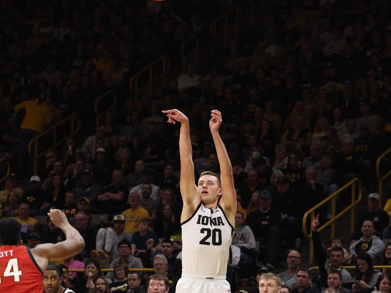 Jan 15, 2023; Iowa City, Iowa, USA; Iowa Hawkeyes forward Payton Sandfort (20) shoots against the Maryland Terrapins at Carver-Hawkeye Arena.  The Hawkeyes beat the Terrapins 81-67. Mandatory Credit: Reese Strickland-USA TODAY Sports