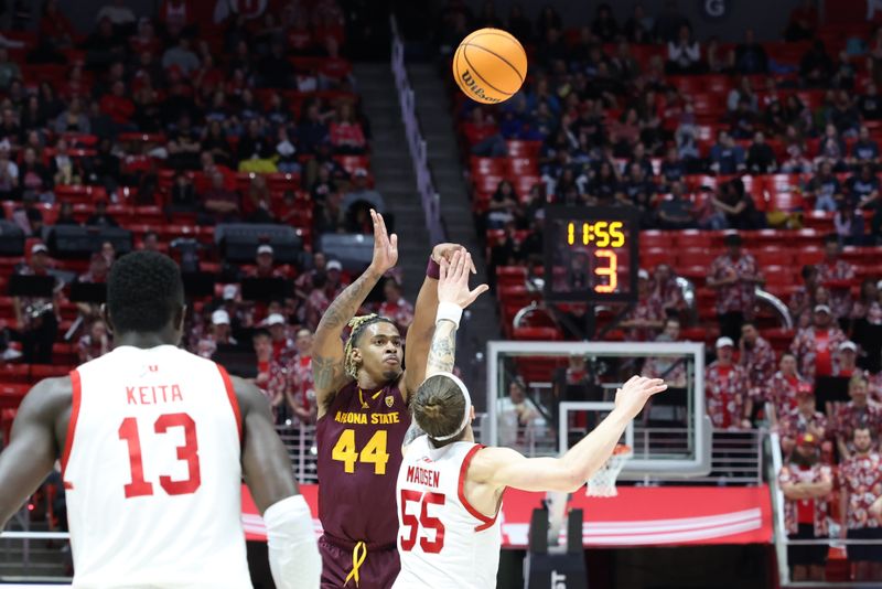 Feb 10, 2024; Salt Lake City, Utah, USA; Arizona State Sun Devils guard Adam Miller (44) shoots a three point shot over Utah Utes guard Gabe Madsen (55) during the first half at Jon M. Huntsman Center. Mandatory Credit: Rob Gray-USA TODAY Sports