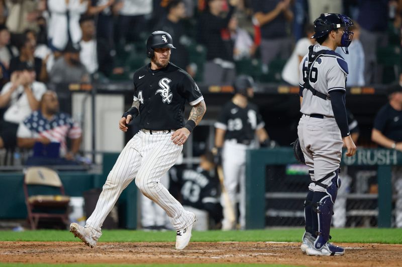 Aug 9, 2023; Chicago, Illinois, USA; Chicago White Sox catcher Yasmani Grandal (24) scores against the New York Yankees during the eight inning at Guaranteed Rate Field. Mandatory Credit: Kamil Krzaczynski-USA TODAY Sports