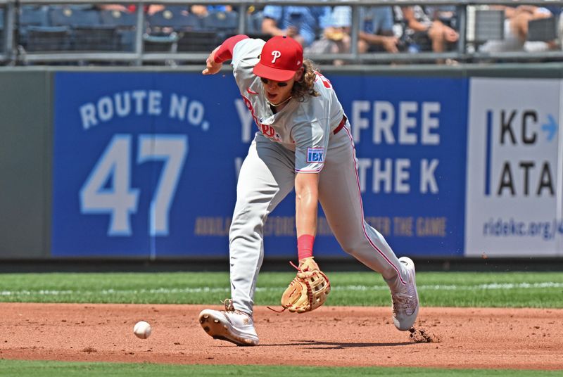 Aug 25, 2024; Kansas City, Missouri, USA;  Philadelphia Phillies third baseman Alec Bohm (28) fields a ground ball in the second inning against the Kansas City Royals at Kauffman Stadium. Mandatory Credit: Peter Aiken-USA TODAY Sports