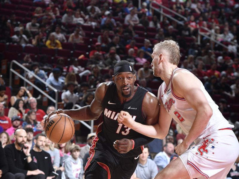 HOUSTON, TX - APRIL 5: Bam Adebayo #13 of the Miami Heat drives to the basket during the game against the Houston Rockets on April 5, 2024 at the Toyota Center in Houston, Texas. NOTE TO USER: User expressly acknowledges and agrees that, by downloading and or using this photograph, User is consenting to the terms and conditions of the Getty Images License Agreement. Mandatory Copyright Notice: Copyright 2024 NBAE (Photo by Logan Riely/NBAE via Getty Images)