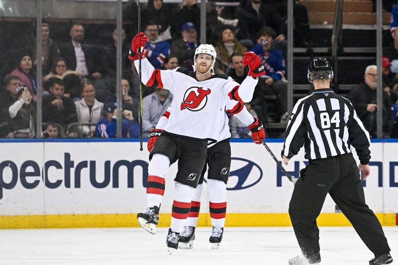 Dec 2, 2024; New York, New York, USA;  New Jersey Devils defenseman Dougie Hamilton (7) celebrates his goal against the New York Rangers during the second period at Madison Square Garden. Mandatory Credit: Dennis Schneidler-Imagn Images