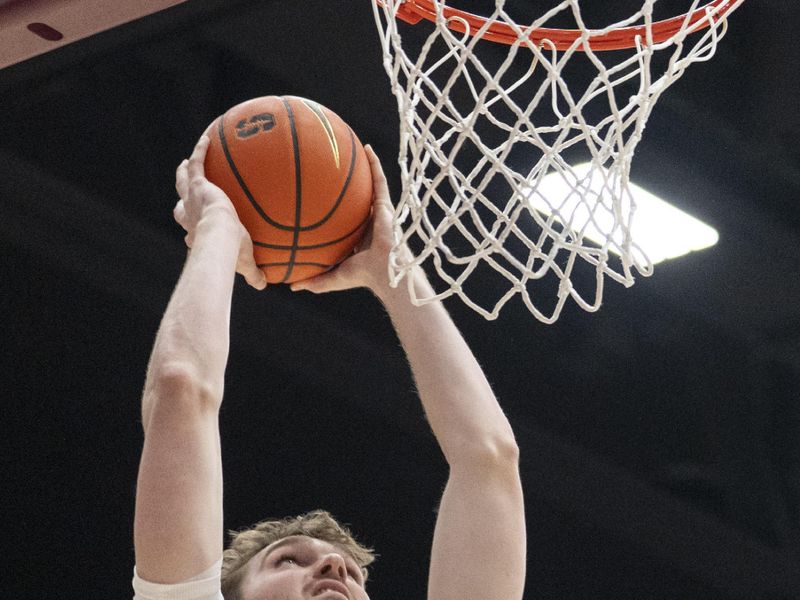 Jan 24, 2026; Stanford, California, USA;  Stanford Cardinal forward Aidan Cammann (52) attempts to dunk during the first half against the California Golden Bears at Maples Pavilion. Mandatory Credit: Stan Szeto-Imagn Images