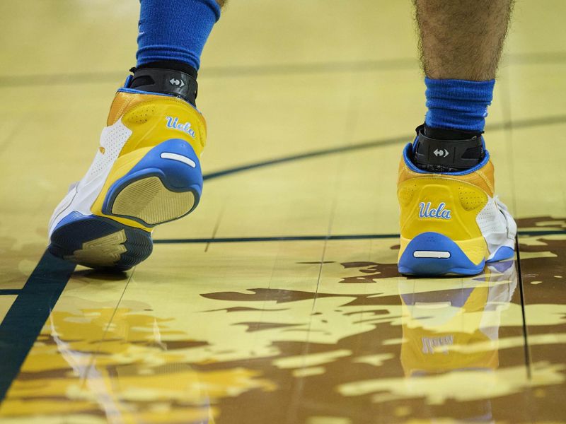 Feb 11, 2023; Eugene, Oregon, USA; UCLA Bruins guard Jaime Jaquez Jr. (24) stands during the singing of the national anthem before a game against the Oregon Ducks at Matthew Knight Arena. Mandatory Credit: Troy Wayrynen-USA TODAY Sports