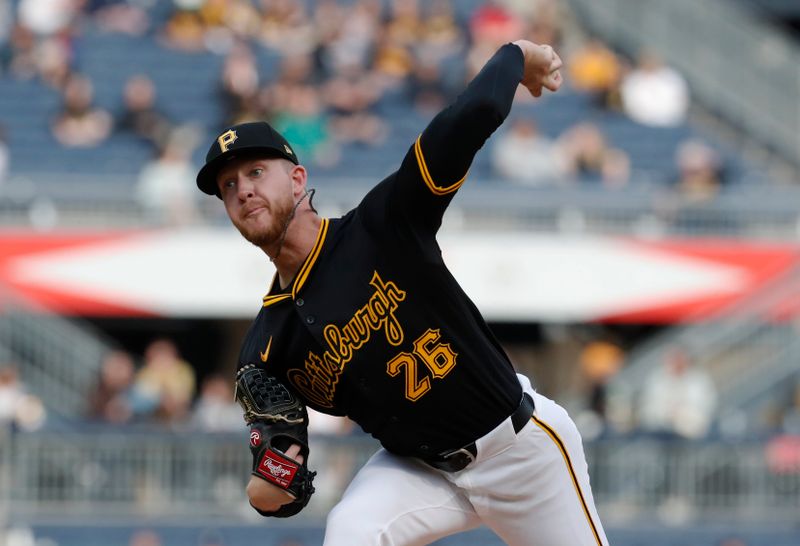 Apr 23, 2024; Pittsburgh, Pennsylvania, USA;  Pittsburgh Pirates starting pitcher Bailey Falter (26) delivers a pitch against the Milwaukee Brewers during the second inning at PNC Park. Mandatory Credit: Charles LeClaire-USA TODAY Sports