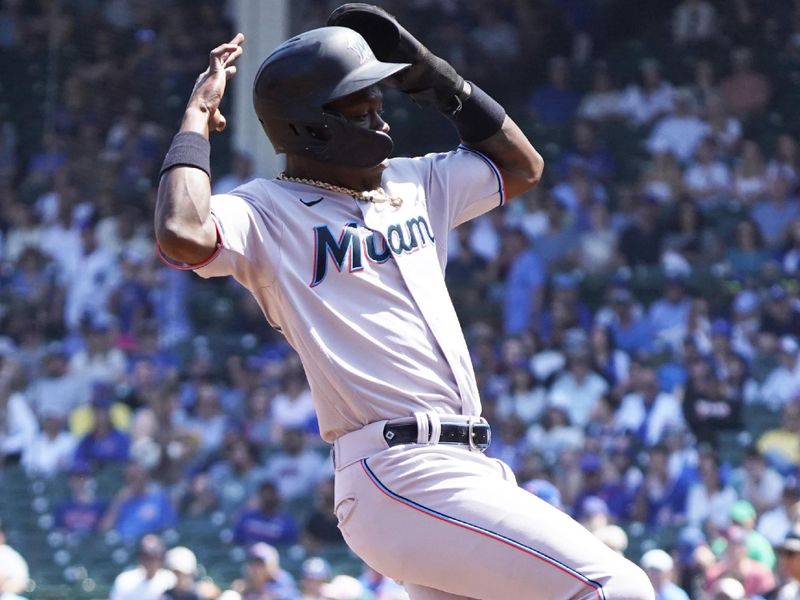 May 7, 2023; Chicago, Illinois, USA; Miami Marlins center fielder Jazz Chisholm Jr. (2) runs to third base against the Chicago Cubs during the first inning at Wrigley Field. Mandatory Credit: David Banks-USA TODAY Sports