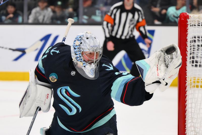 Mar 2, 2024; Seattle, Washington, USA; Seattle Kraken goaltender Philipp Grubauer (31) blocks a goal shot against the Edmonton Oilers during the first period at Climate Pledge Arena. Mandatory Credit: Steven Bisig-USA TODAY Sports