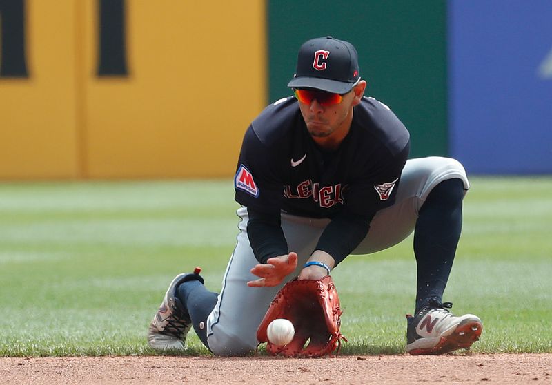 Jul 19, 2023; Pittsburgh, Pennsylvania, USA;  Cleveland Guardians second baseman Andres Gimenez (0) fields a ground ball for an out against Pittsburgh Pirates center fielder Jack Suwinski (not pictured)) during the third inning at PNC Park. Mandatory Credit: Charles LeClaire-USA TODAY Sports